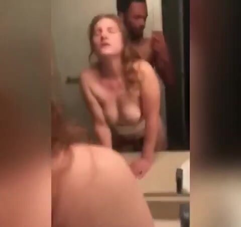 Homemade Interracial Girlfriend Sex - White girl with a black man behind her pounding her hard in restroom