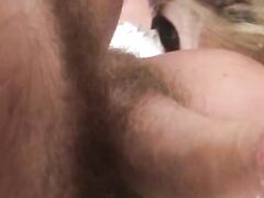 Blonde woman licking his hairy balls and penis